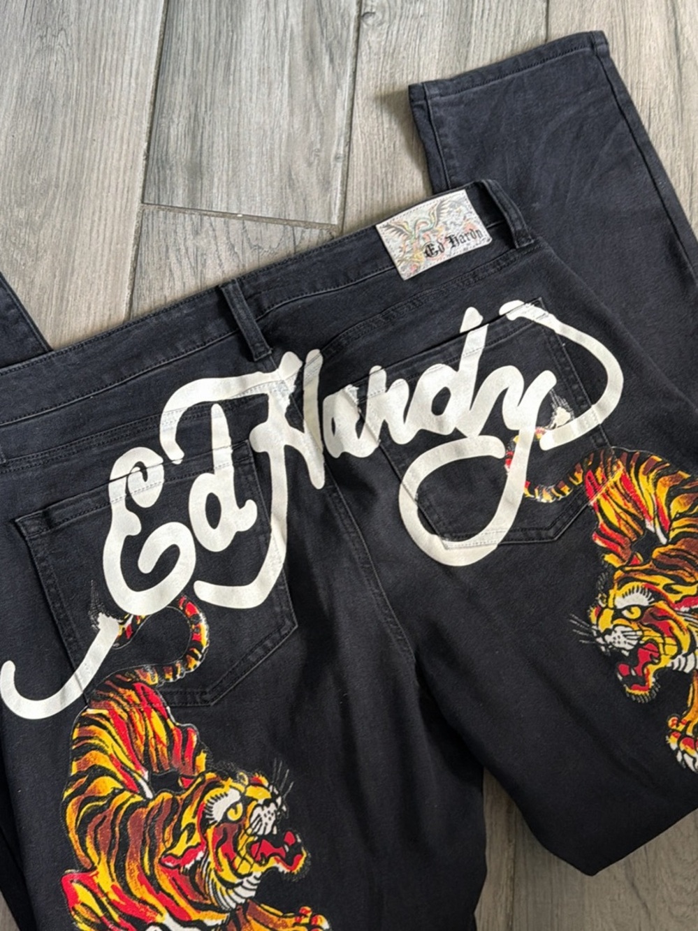 Ed Hardy Black Jeans with White Script and Vibrant Tiger Art